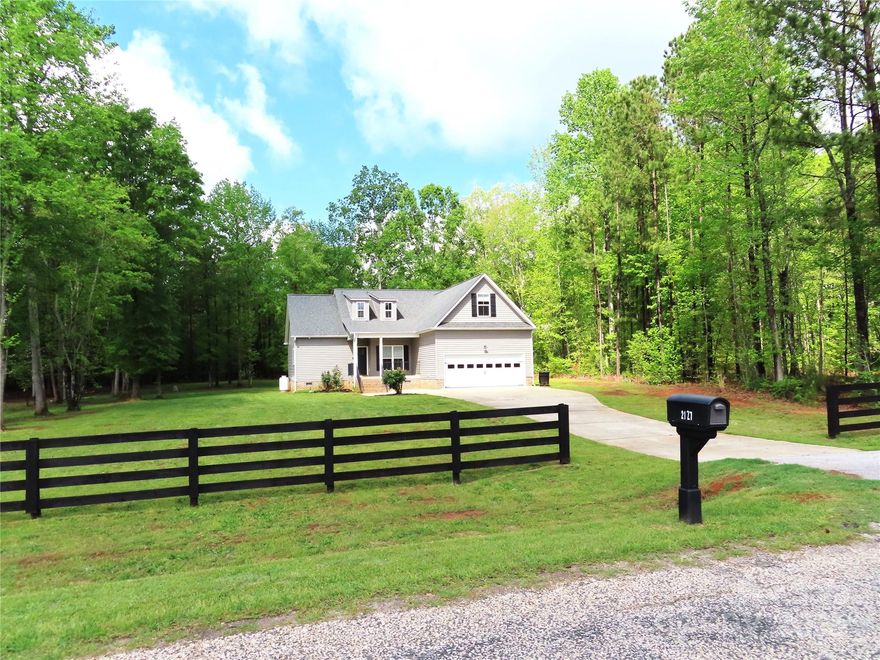 Sitting on 2.5 acres of nice flat usable land and only 4 miles to schools and shopping. No HOA. This home shows like new. Some new carpet and the remainder has just been cleaned. New garage door. fresh paint throughout most of the house, granite, Tile and wood floors also included, just pressure washed and ready to go! The home has 3 bedrooms, 2 baths, dining room and breakfast area and a bonus room.  With covered porches on the front and back  there are plenty of places to relax and enjoy nature.
