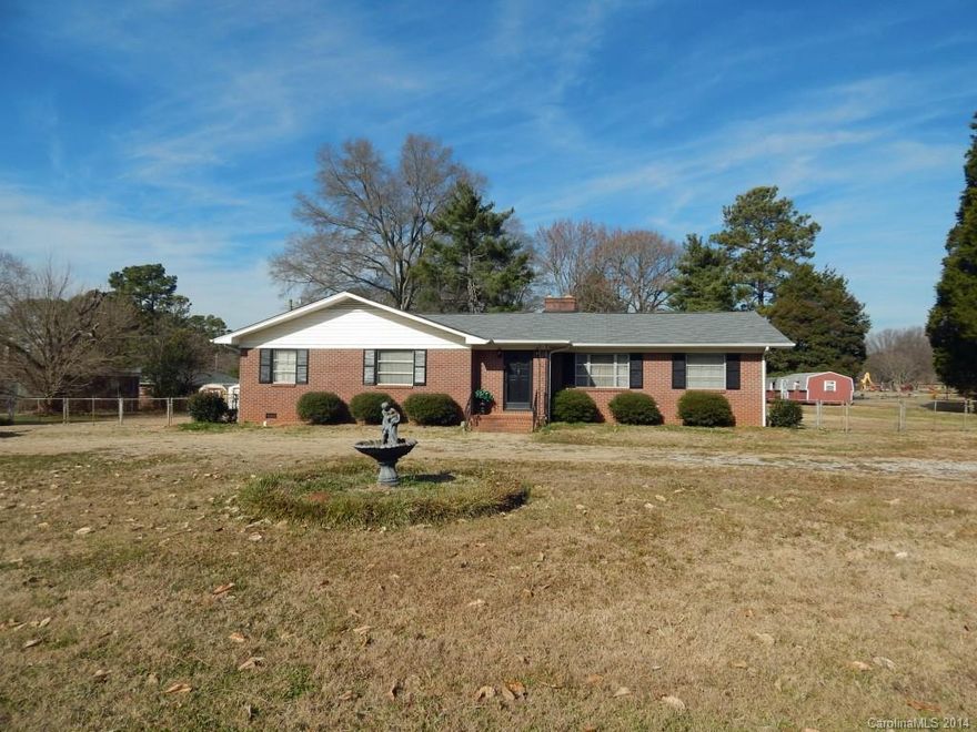 Wonderful home with lots of character on a large lot! This house features a lot of space, large bedrooms, and a large kitchen with attached formal dining room! Behind the house you will find a fenced-in yard, a car port, and a storage shed that remains. Also attached is a windowed/screened-in porch.