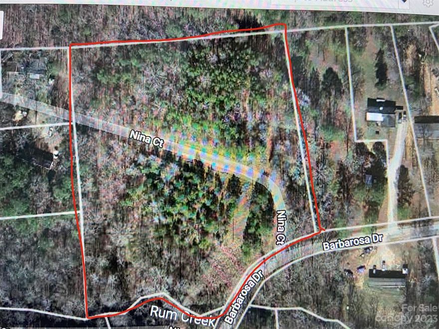 5.4 acres of wooded land in a great location in South Lancaster close to the Golf Course! Subdivide and build stick built or manufactured houses! There is a paved road already in place that divides the property. This property can be subdivided into a max of 5 lots with it's current zoning of Mobile Homes (MH), per Lancaster county. County water is available and county sewer is right at the edge of the property by the creek, but not quite on the property (will need easement from adjacent property owner). See proposed sewer line plan that was provided by previous owner for an idea to bring sewer access in.