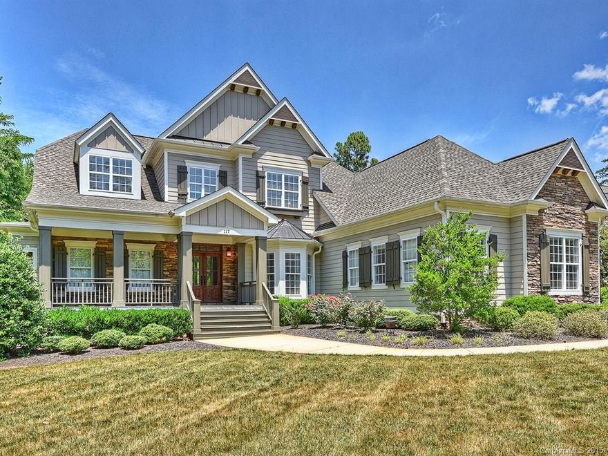 Huge private yard with room for a pool.  Two bedrooms on main and 3 up, each with a private bath.  Two sided fireplace between hearth room and large screened porch. Rocking chair front porch and huge rear deck.  Current owner updated kitchen with new stainless hood, glass tile backsplash and stainless refrigerator. Custom drapes and new decorator light fixtures make this home pop!  Open floor plan with many upgraded features.