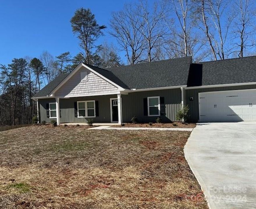 Beautiful open floor plan, new construction sitting on almost an acre.  This home is not in a subdivision, and NO HOA! Rural feel, and minutes from all the conveniences in Statesville. Brand new Whirlpool, stainless steel appliances, quartz countertops and an island included in this topnotch kitchen.  Entry way bench with 2 upgraded receptacles with usb port.   Primary bedroom has walk-in closet, tile shower, and double vanity. LVP floors run through the main living space.  Attached garage.   And don't forget to picture yourself in the additional sunroom sipping coffee or enjoying the warmth of the sun.