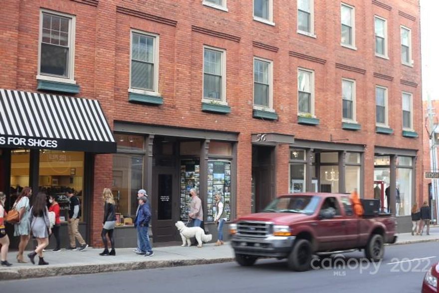 Located in the Downtown Proper Central Business District, this office is at the busy corner of Lexington and College Street. 56 College is a well-maintained historic building with 21st century updates, elevator in main lobby, secured entry door, three bathrooms on each office level and mountain views. Suite 303 has south facing light, large reception area, two large private office and storage closet.  Individually controlled HVAC maintained by landlord. Full-service offices include everything except interior janitorial and Wi-Fi/communications.  Suite 303 is currently occupied.  Existing tenants include attorneys, contractors, engineers and architects. Make an appointment to view this space today!  You won't be disappointed in the overall attractiveness and location of 56 College.  Steps to City Parking Decks; eateries and retail just outside the door.  Handicapped accessibility, sprinkler system; the building and common areas are neat as a Pin!