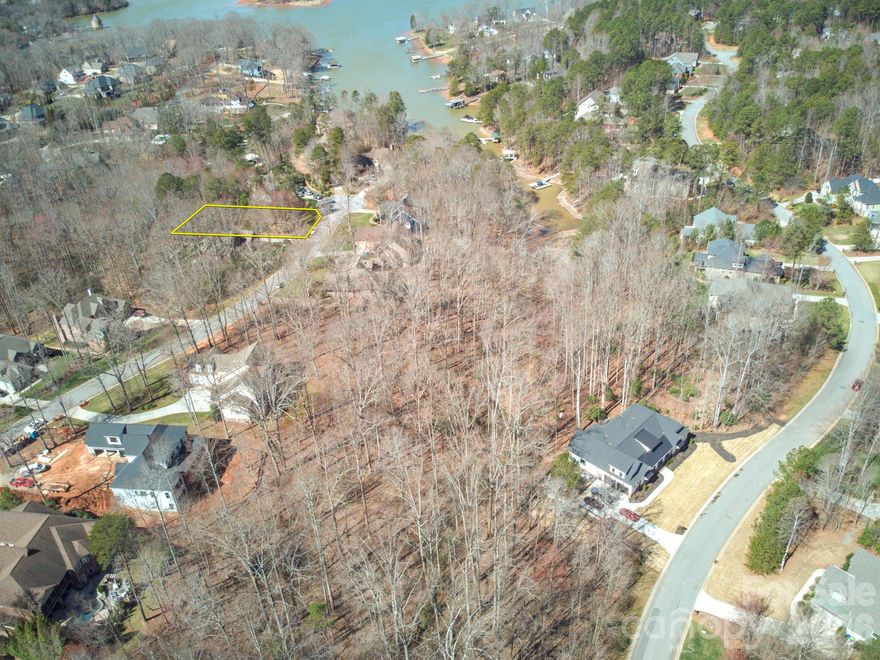 This stunning waterfront, wooded, sloped lot in the quiet Lakewood community offers the perfect setting for your dream home. Located on a cul-de-sac and at the end of a peaceful cove, this property boasts water views and privacy. Just minutes from the Little Creek Boat Access Area, it’s ideal for water enthusiasts. The lot is in an established community with county water and sewer, plus natural gas is available. HOA boat storage is offered for an additional fee. Conveniently located with an easy commute to Charlotte and close to restaurants, shopping, medical facilities, and schools, this lot offers the perfect balance of peaceful lake living and accessibility to local amenities. Don’t miss this opportunity to create your perfect lakeside retreat!