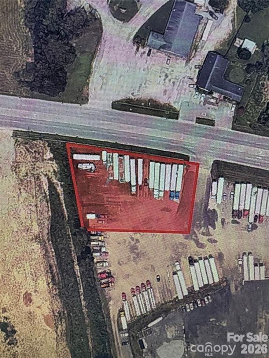 Unique opportunity to purchase a portion of a larger ±20-acre property located directly off the highway in a prime growth corridor. The seller is open to adjusting the land size—smaller or larger—to meet the buyer’s needs. The referenced ±0.95 acres is an estimate only and has not yet been surveyed. As shown in the listing images, access to the parcel is currently provided via an existing drive path that the seller allows to be used, effectively serving as an access easement to the portion being conveyed. The parent parcel is located within a 100-year flood zone; however, a fill permit has already been approved to raise this section of the property, creating a strong and usable building area. The property is currently being used for truck parking. Electricity, water, and sewer are conveniently available. This location offers excellent visibility, access, and flexibility for a variety of potential uses. Buyers are advised to confirm all zoning, allowable uses, and development requirements with the county.