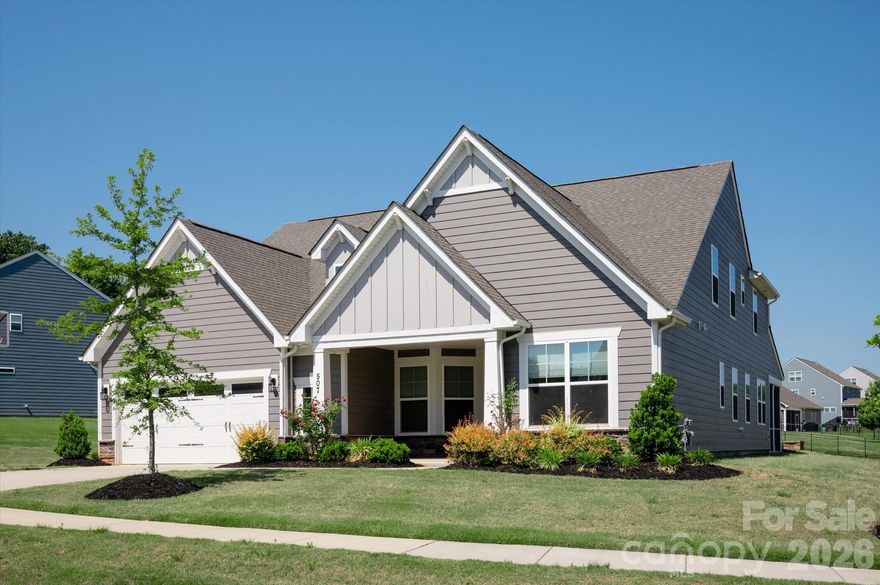 Beautiful recently built ranch style home located on a spacious .61 acre lot in the popular town of Waxhaw. Great floor plan features over 3,200 square feet of sophisticated living space, thoughtfully spread out across one and a half levels. The main level includes a spacious open-concept living area, two generously sized secondary bedrooms, each with an individual full bath, a dedicated dining room with a tray ceiling and decorative wall moldings, and a private office with French doors. Also on the main is the primary bedroom featuring a tray ceiling, a luxurious quartz tile bathroom with separate vanities, a custom walk-in closet with direct access to the laundry room, and an abundance of windows which fill the space with natural light. Located on the second level is a convenient loft which features built-in cabinets and quartz tops. The loft also includes a secondary bedroom, a full bath, and a closet, perfect for guests.
This home also allows for outdoor living with a comfortable screened-in porch, paver patio, fire pit, and an expansive backyard. As a part of Wrenn Creek, you'll enjoy community amenities, including sidewalks, walking trails, a cabana, and a neighborhood pool. All under ten minutes to downtown Waxhaw. Don't miss out on this move-in-ready home in a highly sought-after location!