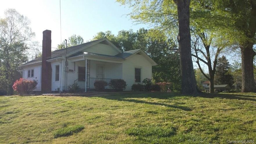 Come visit this 2 Bedroom home on 3+ acres! Freshly painted, new ceramic tile in bath, hardwood floors in living room, new carpet in master bedroom, replacement windows, metal roof & more! Property has fruit trees, grape vines & beautiful flowering shrubs! Won't last long!