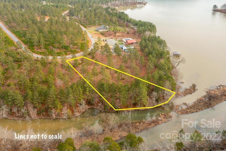 Spectacular LAKE FRONT LOT located in desirable "The Waterfront Club"!! A NEW gated subdivision that's sure to please the Lake lover at heart!! Build your dream home or that get-a-away vacation home on this private 1.23 lake front estate. Be one of the first to live in this lovely community, that's sure to become a desirable place to be on Lake Rhodhiss. Pristine water views, quietly tucked away from large commercial areas. Enjoy scenic boating excursions, fishing or water sports. Dine in local eateries and hometown breweries, and convenient access to major roads that can take you to Charlotte or the Blue Ridge mountains in a short hour drive. Annual dues for The WATERFRONT Club include waterfront pavilion, with private community dock, lake front fire pit, clubhouse and pool. Don't miss one of the limited LAKE FRONT LOTS!