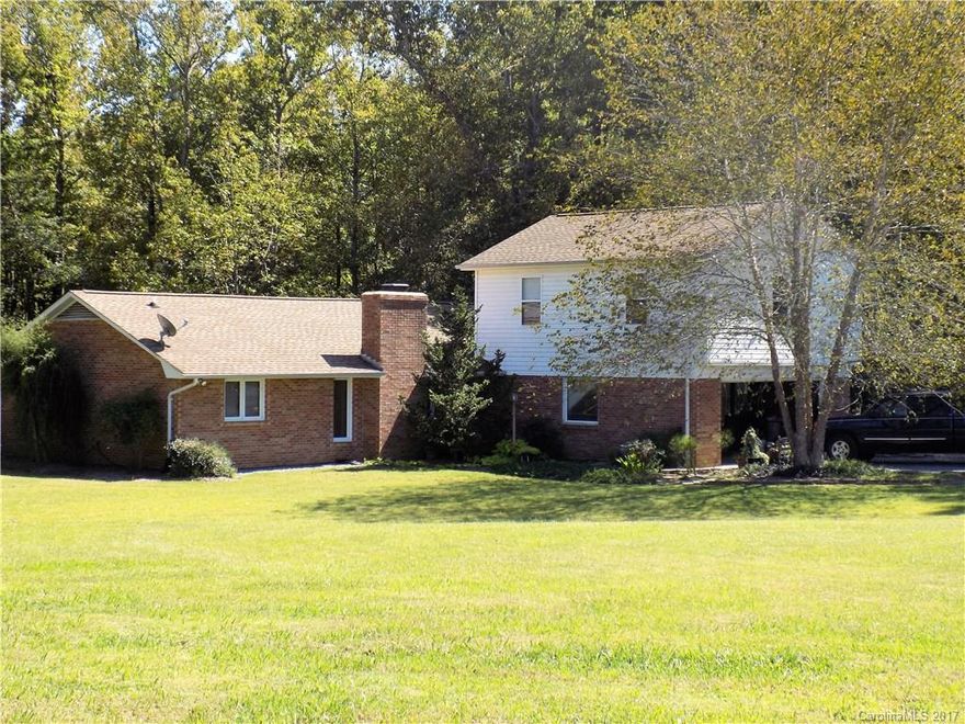 Looking for that country feel, but still close to town? 3 bedroom, 2 bath + bonus room all on 2 acres! Enjoy overt 1,800 sq feet of comfortable living on this beautiful piece of property.  New carpet, fully renovated bonus room above garage, fully fenced back yard with additional buildings for storage/workshop. Wood burning fireplace surrounded by beautiful stonework. 1 year standard home warranty from Old Republic to be provided!