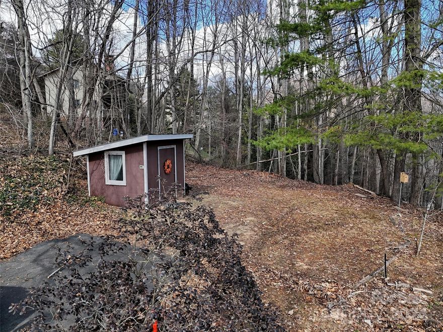 Beautiful building lots on a gentle level ridge at Lake Junaluska with paved access.  Location is short distance from Lake J and all amenities are available. These 2 fabulous lots total 0.54 acre. The combined lots are partially cleared; a paved driveway is in place, along with a small storage building.  A seasonal view of the Lake and cross are surprising, as well as a year-round view of the Mountain-scape. City water is available. Septic system is currently required.