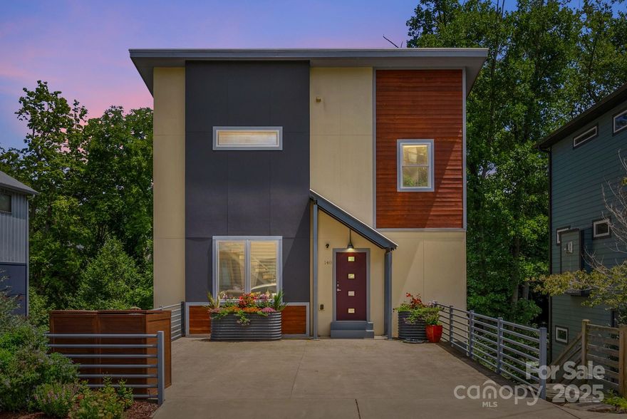 Fabulous house, Outstanding East/West Asheville location - an Urban Adventurer's Paradise! Walk or bike to New Belgium for beer, music, and food trucks. Stroll over to Taco Billy, Owl Bakery and the Admiral for some of the best food in WNC. Easy shopping at Harvest Record, Whist, Flora, Haunt and grab a cuppa at Battlecat! Featuring a balcony on each of the 3 levels, this aesthetically inviting house is in the middle of town with the feel of the woods right in your backyard. The light-filled 1st level offers a clean-line open Kitchen/Living/Dining with an apurtenant Back Balcony/Porch for outdoor dining/entertaining. The entire upper level is a private sanctuary dedicated to a primary suite with walk-in closet and contemporary gorgeous master bath. The lower level: 2 bedrooms, both with balcony access and 2 full baths.Beautiful Landscaping with drip irrigation will calm your senses while enjoying your peaceful creekside lot. Tons of storage for your bikes and kayaks. Easy to Show!