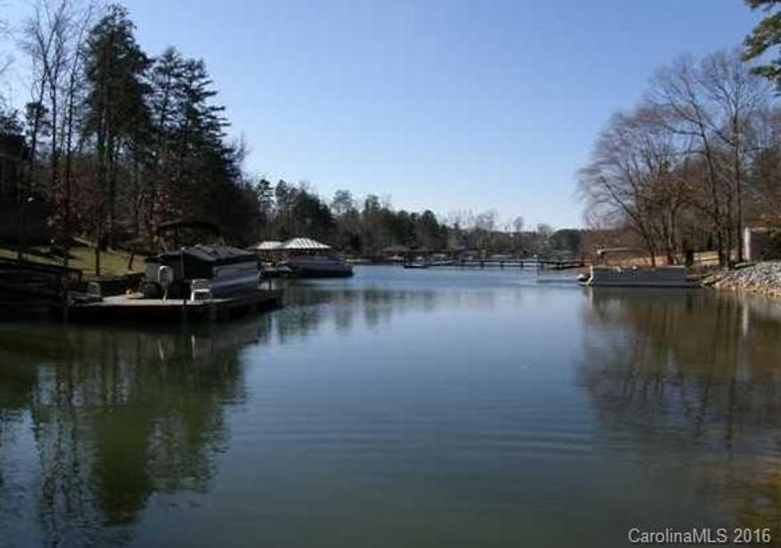 Large waterfront lot, with pier and boat slip in place. The perfect place for you to build your dream home!