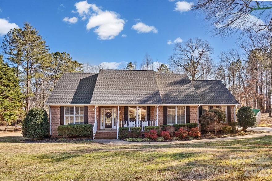 NEW PRICE! Country charm meets custom detail! 5 min to I77! Stunning all brick ranch w/ 9 ft ceilings offers the space you crave with a community where neighbors look after one another. Beautiful entryway into the Heart of the home-a gorgeous family room w/ vaulted ceilings. An impressive floor to ceiling stone fireplace, is THE focal point! Sizeable kitchen with an island & a cozy space for breakfast. Dining room open to the kitchen. Enjoy a split bedrooms for maximum privacy. Primary bedroom is a true sanctuary. Roomy & spacious for a King size set. 2 car rear detached garage with a "flex" room. Can be office/gym/school, or a cozy "book nook". Rare find in this neighborhood. Get your showing scheduled! List of updates in assoc docs.