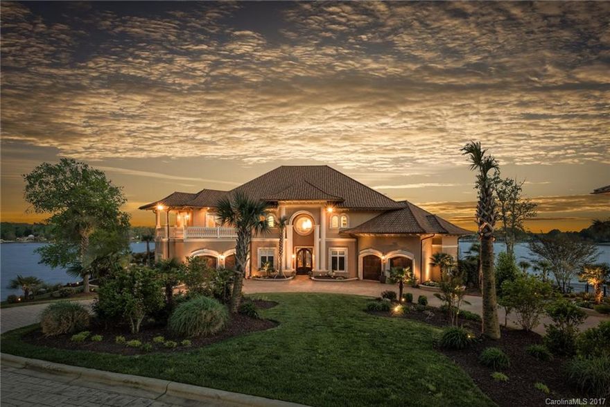 Spectacular private waterfront estate, some of the best views on Lake Norman! 8 car garage! 6 acre peninsula lot with long range panoramic lake views. Main house is 7000+ SF with 5 bedrooms (perks for 4), the separate guest house is 1800 SF with 2 bedrooms. This home has been completely remodeled inside and out with top of the line finishes. Italian marble flooring on main level. Infinity salt water pool & hot tub. Long private driveway. Fenced yard.  Private pier with boat slip & Lift.