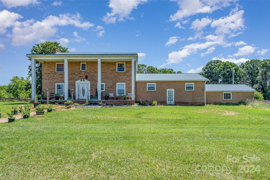 Welcome to your dream country retreat! This picturesque 5-bedroom, 3-bathroom farmhouse is nestled on a sprawling 4.9-acre property in Statesville. Enjoy the lush land, perfect for gardening, raising animals, or simply relishing the tranquility of rural living. Own a piece of history with a charming general store right on the property – perfect for a home business or hobby shop.