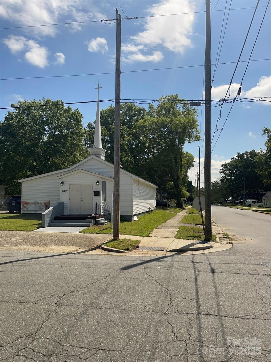 This beautifully maintained church offers a unique opportunity for a growing congregation. Situated on a  corner lot, the property features a welcoming and spacious foyer that leads into a large sanctuary, perfect for worship, gatherings, or events. The layout includes two private offices, a dedicated sound room, a versatile flex space, and a kitchenette with ample storage, providing flexibility for a variety of uses. Two restrooms and dual entrances offer added convenience and accessibility. Recent updates completed in 2024 including new HVAC systems, new roof and new siding.The property also features a gravel parking lot with ample space to accommodate guests. Located just minutes from downtown Rock Hill. Don’t miss out on this exceptional opportunity!