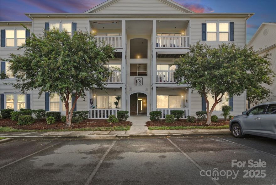 Would you love the convenience of uptown living without the uptown price tag? This move-in ready condo at Harrisburg Town Center is just what you’ve been waiting for! The open main living area features stylish vinyl plank flooring, kitchen with stainless steel appliances, and a charming barn door separating the kitchen and laundry space. The split bedroom plan provides privacy, while the deck (with storage closet) overlooking the town center offers a perfect spot to relax. With one dedicated parking space and plenty of guest parking, convenience is built right in. Enjoy walking to grocery stores, restaurants, medical and fitness facilities, and more—all just steps from your front door. Easy access to highways and entertainment venues makes this home an ideal blend of comfort and location. Offering $2,000 in seller paid closing contribution if under contract by January 15th.