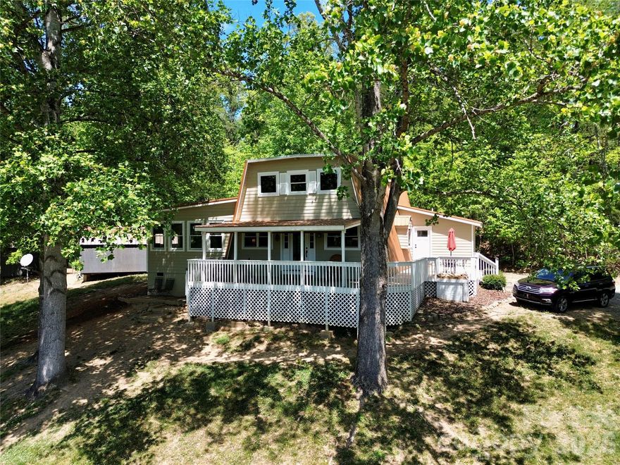 Enjoy your daily drive home to this secluded, turnkey cabin on the hill! This 4.3 acre property features a 2,264 sqft, 3-bed, 3-full bath updated cabin, 2 storage buildings and a chicken coop. This move-in-ready home has new flooring, updated kitchen cabinets and quartz countertops, new metal roofing, new interior and exterior paint, updated windows and doors, new well pump and much more! Make your morning coffee and sit on the wrap-around porch, while listening to the sounds of nature and wildlife! Bring your animals and livestock, the pasture is surrounded by forest for privacy and seclusion. Step through the front door to a bright, expansive open-concept floor plan with tall ceilings. Plenty of light for those beautiful sunny days! The fully updated kitchen, in the center of the home, has a plethora of room for large gatherings, attracting your guests' attention! There is a laundry room with a utility sink and plenty of storage! The main floor has a living room, as well as a great room, large closet and a fully updated full bath for all your guests. The main floor master bedroom has its own full bathroom. The bathroom features stone flooring, a new vanity, new commode and a large shower with 2 shower heads with a beautifully tiled shower bench. Walk up the spiral staircase to the second floor which contains a spacious loft overlooking the 1st floor and the vibrant front windows outlooking the mountain views, 2 bedrooms and an updated full bathroom! This house is stunning with aspects of a timeless cabin with modern touches throughout! 

Live in the seclusion of the mountains while being close to all modern needs and wants! This home is 20 minutes to Chimney Rock State Park and Lake Lure! Asheville is 1 hour away; shopping and amenities are within 20 minutes in both directions. 

The land is unrestricted, bring your hunting buddies and relax in the woods! There is a custom built firepit in the pasture for those starry bright nights! Make this your permanent homestead, an AirBnB, VRBO, rental or anything your imagination desires! There is an entrance to the great room, from the rear driveway of the home. There is a wired security camera system installed as well!