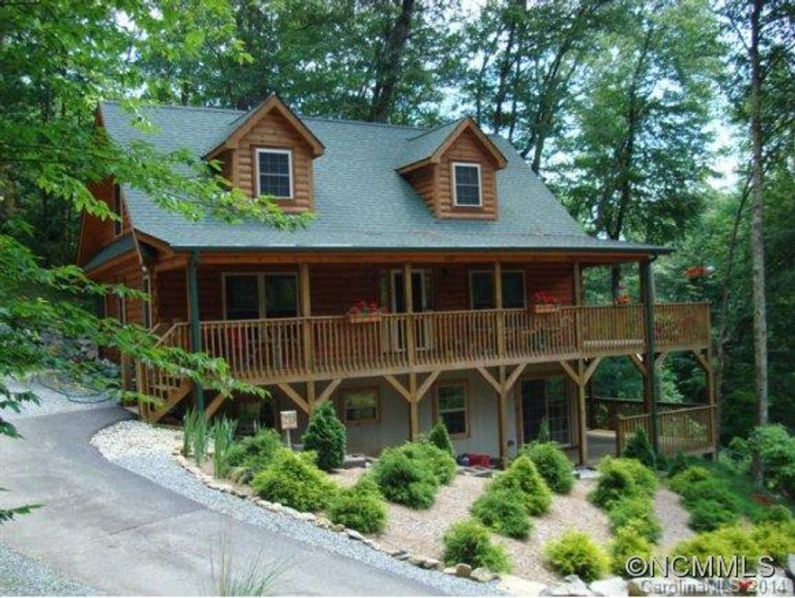 Beautiful well kept log home with all paved access. Views of golf course, nicely landscaped w/wooded setting, wrap around double deck to enjoy cool summers. ALL FURNITURE,FURNISHINHS,& DECOR INCLUDED.Seller owned L/P gas tank included.Home surge protection system. Boulder retention walls. Private community water system.