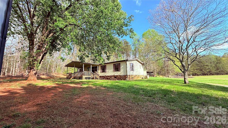 Welcome to your own slice of peaceful country living! Nestled on 1.03 beautiful acres, this charming 3-bedroom, 2-bath home offers the perfect blend of privacy, space, and comfort.

Step inside to an inviting open-concept living area featuring warm wood accents, vaulted ceilings with exposed beams, and abundant natural light. The spacious layout flows seamlessly into the kitchen, making it ideal for entertaining or everyday living.

Enjoy quiet mornings on the covered front porch, overlooking a gently sloping yard surrounded by mature trees—perfect for relaxing, gardening, or creating your own outdoor retreat. The property also includes two outbuildings, providing extra storage or workspace potential.

With plenty of room to spread out both inside and out, this home offers the tranquility of country living making this an opportunity you won't want to miss out on! Call for your showing today!