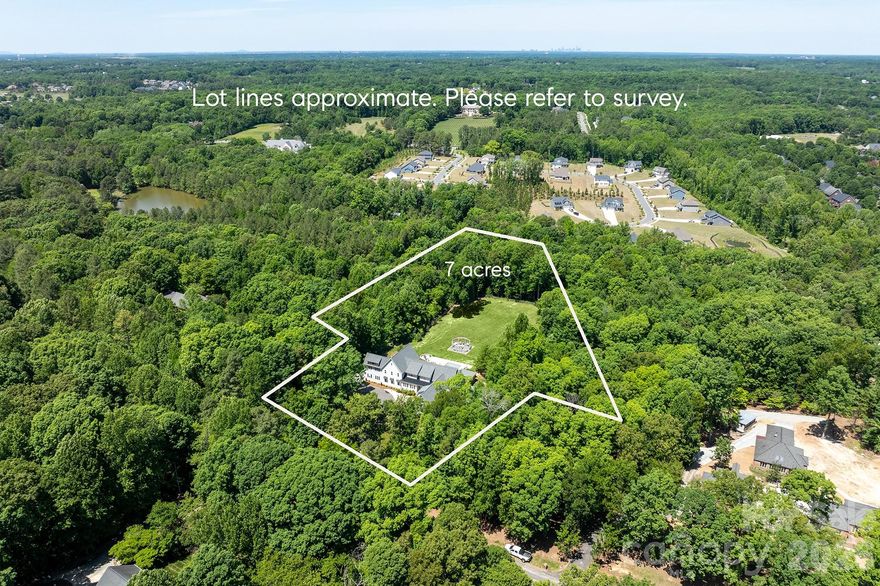 Tucked away on a breathtaking 7-acre estate in Marvin, this completely gut-renovated home offers a rare blend of luxury, privacy, and everyday functionality, designed for the way you actually live. From the moment you step inside, you’ll notice the level of detail and thoughtful design throughout. The brand-new chef’s kitchen is truly the centerpiece, featuring two oversized islands with striking waterfall countertops, double refrigerators, and an expansive butler’s pantry that makes entertaining effortless. Whether hosting a crowd or enjoying a quiet night in, this space delivers on both form and function.

The layout is as versatile as it is beautiful, featuring dual primary suites, one on the main level and one upstairs, ideal for multi-generational living or guests. With two dedicated home offices, working from home has never felt more elevated or efficient. Upstairs, you’ll find a thoughtfully designed retreat complete with a spacious playroom and four en suite bedrooms, each with newly updated bathrooms. The primary suite is a true sanctuary, offering his-and-hers walk-in closets, a soaking tub, and double vanities for a spa-like experience. The fully finished basement is a destination in itself, complete with a home theater, private workout room, and a pool table, plus additional living space that adapts to your lifestyle.

Step outside and experience your own private retreat. The resort-style backyard showcases a pool, hot tub, and cabana with a full outdoor kitchen, all surrounded by the serenity of your expansive acreage. Whether it’s weekend entertaining or a quiet evening under the stars, this property delivers unmatched outdoor living.

Additional highlights include two laundry rooms, a four-car garage, and a seamless blend of luxury and practicality throughout. This is more than a home, it’s a lifestyle property offering space, privacy, and high-end living just minutes from everything Marvin has to offer.