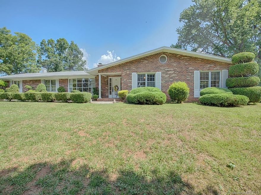 Only minutes from Asheville, this classic ranch with four bedrooms offers spectacular mountain views, end of the road privacy, and the convenience of being in the city limits.  Wood stoves are located on the main living area, as well as the basement.  The basement, containing it's own bathroom, could easily be finished to add to the already large living area.  The home has a two car garage and plenty of parking.  This could be the one you are looking for!