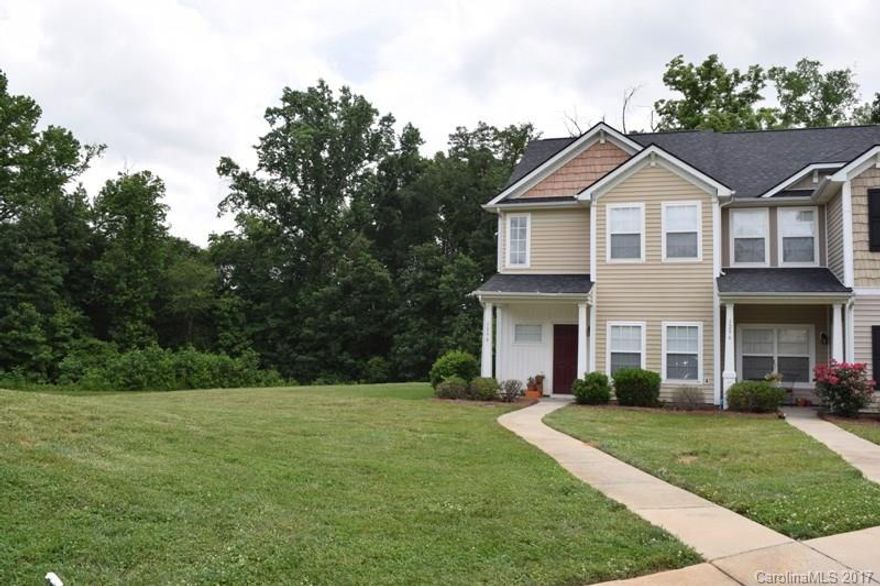 Adorable studio-like townhome shows like a model. This end unit backs up to green space, quick access to soccer fields.  Lovely home has a nice flow, open floor plan with an artistic touch.  Formal dining room, great kitchen with breakfast bar, and electric fireplace in living room with vaulted ceilings.  Three large bedrooms, and two complete baths on the upper level.