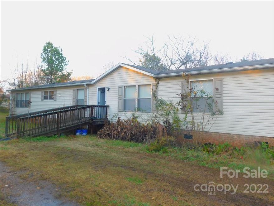 This is a 2002 Clayton Hartlander, 28 x 80 with 4 bedrooms, 2 bathrooms and sits on 2.06 acres with a powered 30 x 30 Steel Metal Building on a concrete slab with a 10 x 12 Roll up door and a man door. New Carpet and Flooring in Kitchen. Seller started painting but there is still more to be done. Just needs a little TLC, as well as the front ramp and back deck needs some work which is all reflected in the listing price. Property is being sold "as is".