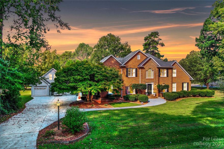 Experience the charm of lake living in this custom-built, full-brick home located in this desirable Langtree community at Lake Norman. With 3 lake access points (1 just across the street) and additional amenities like a day dock, boat ramp, and dry boat storage, this home offers the best of lakefront living. Newly updated with a fresh coat of paint and modern fixtures, this 5-bedroom residence offers a perfect blend of elegance and comfort. Enjoy lake views from EVERY window (literally), creating a serene ambiance throughout the home. The home features 2 primary bedrooms, 1 being on the main level with dual walk-in closets and a luxurious bath with a jetted tub and separate shower. The kitchen is a delight with a center cooktop island, granite counters, ample cabinetry, and stainless steel appliances. The great room, highlighted by a fireplace with gas logs, opens to a large deck overlooking your giant backyard. Reach out today!