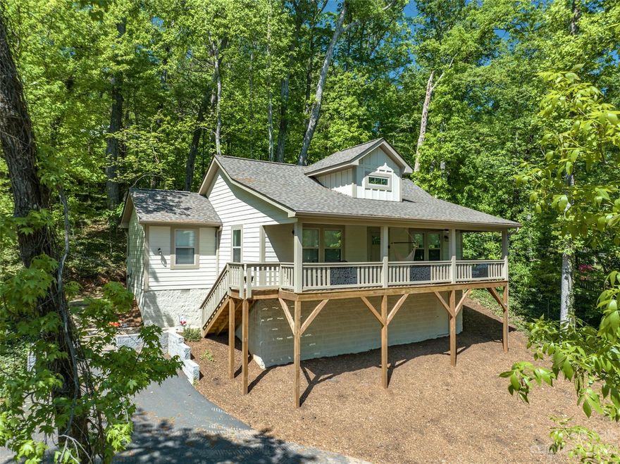 Absolutely stunning craftsman style home in pristine condition located in the beautiful town of Tryon, NC. Ideal location and just a short walk to town! This open concept home has so many upgraded features beginning with the stone walkway that leads to a stately front porch with incredible views. As you enter the home, you'll be greeted by a bright and airy living room with large windows that flood the space with natural light. The living room flows seamlessly into a cozy dining area, perfect for enjoying meals with family and friends. Upgrades throughout include granite countertops, solid doors, wide trim and brand name fixtures and appliances. Wide plank Pergo flooring in the main living area and tile in the bathrooms.  There is plenty of storage with large walk in closets, a large laundry/mud room and lots of space in the crawlspace. Don't miss your chance to make this wonderful property your own! Schedule a showing today and see all that it has to offer.