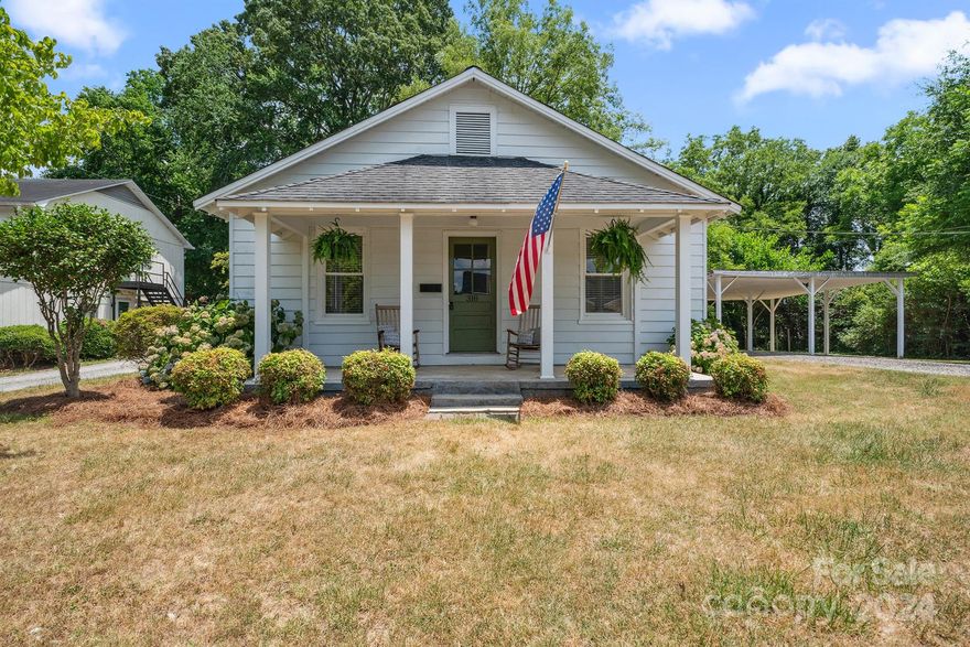 Experience downtown living in Lincolnton with this charming two bedroom, one bathroom home. Not only are you just a few short blocks to Main Street you are also right across the street from the park. What a nice view to have as you are relaxing on your front porch which has two hydrangea bushes on either side and are beautiful when in bloom. As you enter inside you will find that this home is just as charming on the inside. It has many features you hope to find in a home this age such as gorgeous hardwood floors and solid wood doors. Situated on a .4 acre lot which is a great size for a downtown home and creates many possibilities for different uses. Storage building in the back would be perfect for your riding lawn mower or tools. This home is waiting for you to create happy memories!