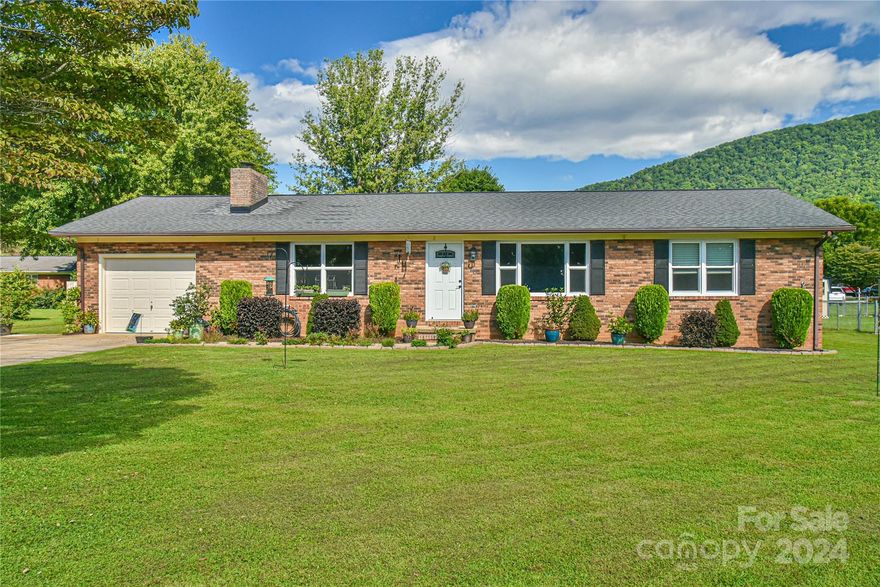 Nestled in a wonderful neighborhood, this immaculate brick ranch offers 3 bdr 2bath. The open floor plan creates a seamless flow throughout the single-level home, providing an inviting space for both daily living & entertaining. Conveniently located between Old Fort & Marion, this home offers easy access to local amenities while maintaining a peaceful environment. Outdoor enthusiasts will appreciate being just 10 minutes from the loading ramp at Lake James, perfect for weekend adventures on the water & provides access to charming small-town vibes, shopping, & dining. The property features an expanded driveway, providing ample parking space, & a flat, easily maintainable yard. The fenced back yard offers security, ideal for pets or outdoor gatherings. Gardeners will be delighted by the raised beds, perfect for growing flowers or vegetables. The beautifully landscaped grounds are complemented by year-round mountain views, creating a tranquil & picturesque setting to call home.