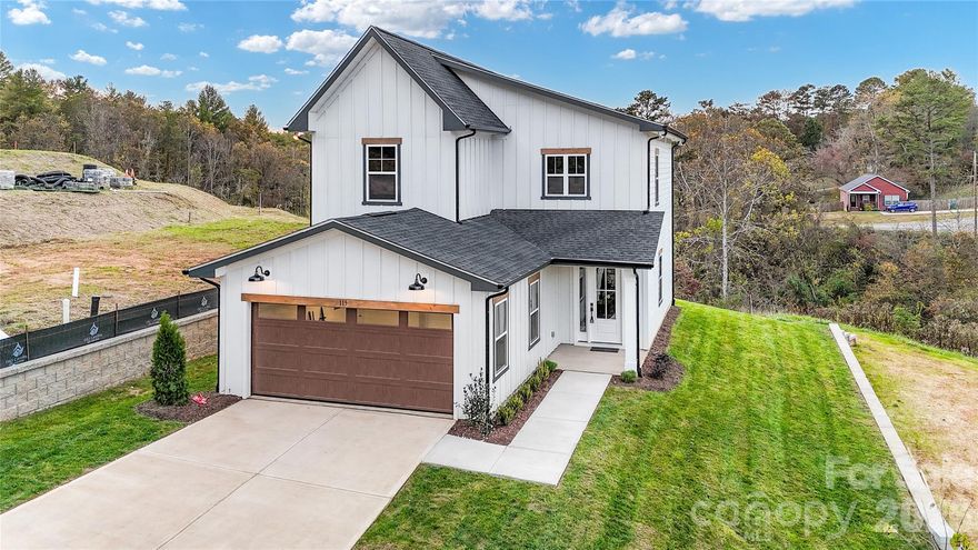 Introducing 115 Chapel Crossing lane, an exceptional new construction home built in close proximity to downtown Weaverville. This custom home is perfectly positioned to allow you to take in the most breathtaking year-round views and immerse yourself in the blend of comfort and elegance! We invite you to step inside to a warm and inviting living space where 10 foot ceilings, 8 foot doors and expansive windows bring in an abundance of natural light. This spacious main level offers an open concept living that seamlessly blends the kitchen, dining, and living areas into one. The Kitchen allows for ease of entertainment and offers desired finishings. The upper level, becomes a showcase in this 3 bedroom home design, featuring vaulted bedroom ceilings and craftsman trimmings. The primary bedroom on this level features a tray ceiling, a luxury ensuite and the most spectacular views. While the bedrooms offer serenity, be ready to have convenience with this home just minutes from shopping, restaurants and entertainment. 115 Chapel Crossing is calling your name, be ready to be spoiled with its charm, views and unbeatable location. Now offering a stainless steel side by side refrigerator, washer, dryer and blinds!

Open Houses every Saturday and Sunday!