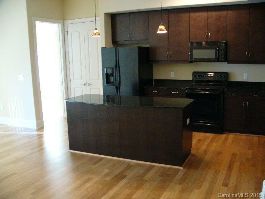 Very nice and clean 2 br. 2 ba. upscale southpark condo with dark cabinets and hard wood floors throughout except for tile floors in both bathrooms.  Granite countertops.  High ceilings.  Large wak in closets in both Br's. Great location over looking the fountain, all the restaurants, wine bar, and onsite YMCA.  Rooftop pool and clubhouse.  Gated and secured parking deck with 2 spaces.  Refrigerator, washer & dryer included.