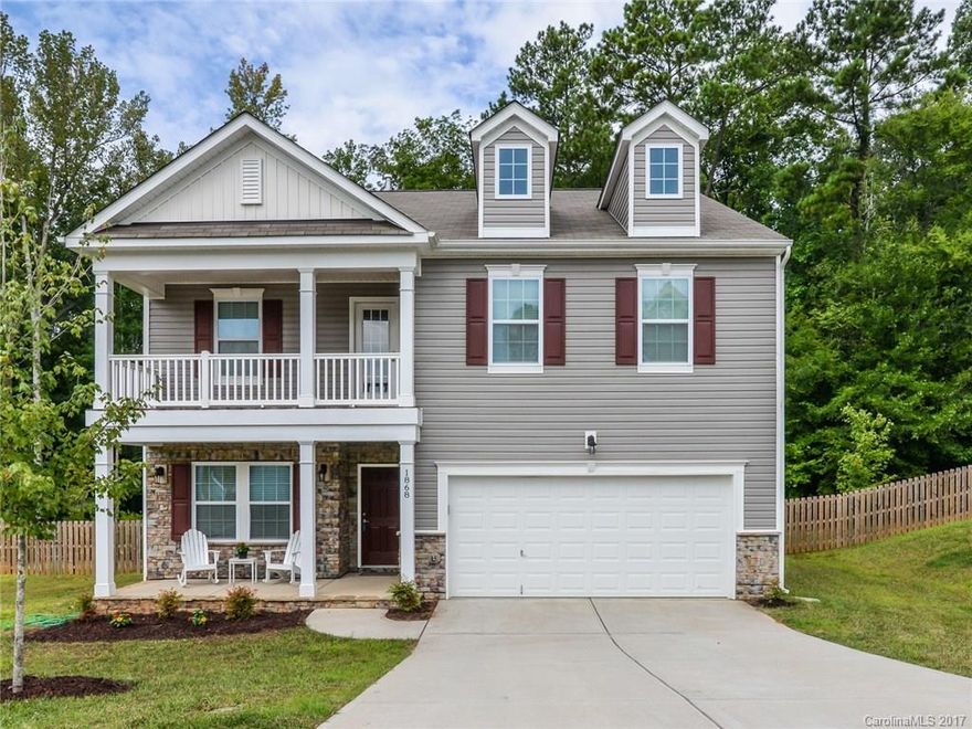 LIKE NEW!! 5 bed 3 bath home on cul-de-sac in Mill Creek Falls! Shows like a model! Beautiful luxury plank floors throughout main level, spacious kitchen w/granite countertops, stainless appliances & breakfast bar, formal dining room, large fenced yard with woods behind for privacy, bedroom&full bathroom on the main level, bonus room upstairs with door to 2nd floor balcony, large master suite with dual sinks, walk-in closet, garden tub,& separate shower, and so much more! Don't miss out!!