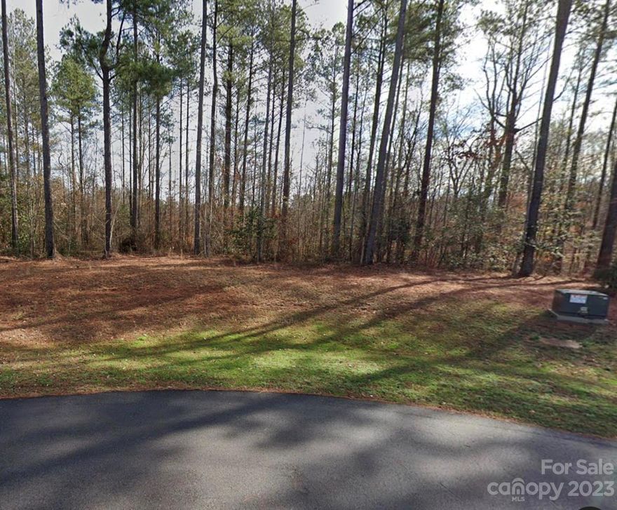 ABSOLUTELY beautiful lot on a level serene wooded 2.16 acres! Tucked in between a wooded cul-de-sac and a corner lot.  Henry's Glen is a very secluded neighborhood.  Very private lot with a creek running through the back.  This is a much see in person!  Build your dream home and be only minutes away from shopping, restaurants in Lake Wylie or downtown Clover and only 15 minutes from Charlotte! Septic permit already approved for a 5 bedroom home.  Home to be a minimum of 2700 sqft.  Schedule a showing today!