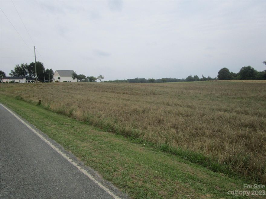 Beautiful, level acreage (Tract I) in picturesque country setting. Conventional perc site and county water close but would be Buyer's/Builder's responsibility to access county water. Amazing homesite with 5 acres perfect for your gorgeous custom home! Popular, rapidly growing area features rural setting close to University, shopping, schools, hospital, golf course,etc. Easy access to Highway 74 and by-pass.  Come and pick out your Tract today! Take the time to come and check this out. You will be impressed! Last vacant tract left!! Don't miss out!!