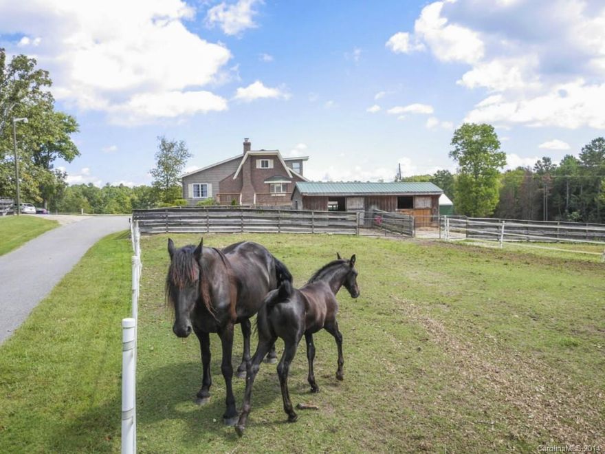 Clover Equestrian Estate for True Horse People! Lovingly maintained 12 acre farm. Professional equine accommodations: 8 stall main barn with indoor arena. 2 breeding barns with professional surveillance equipment, 3 run up barns, and 9 fenced pastures. For the humans, over 3400 sq. ft home overlooks it all with beautiful views and separate living quarters for trainer or guests.Perfect event setting for weddings, conferences, parties and other events. Please make an appointment to view.