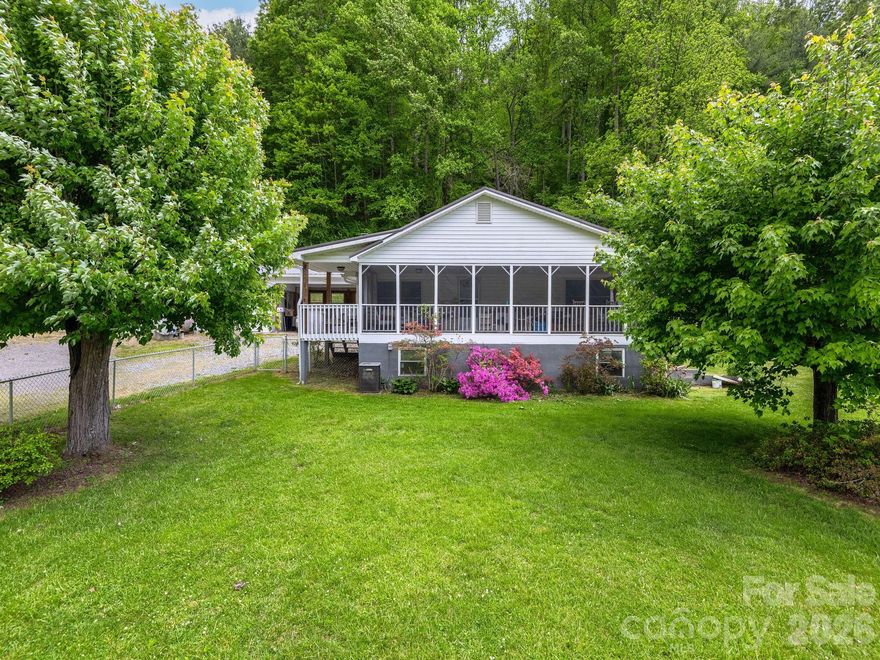 SCENIC 4.4 ACRE HOMESTEAD WITH MOUNTAIN VIEWS IN BEAUTIFUL BARNARDSVILLE! A perfect property blending privacy, charm, and usable land ideal for a mini farm or homestead lifestyle. Surrounded by the breathtaking mountain views and pastoral landscape Barnardsville is known for, this special property features multiple areas for crops, gardens, and livestock, creating endless opportunities for sustainable living, hobby farming, or your dream mountain retreat. According to the family, natural springs are located on the property, adding to the character and potential of the land. Neighboring successful farms, including Ivy Creek, further enhance the property's authentic agricultural setting and appeal. Inside, you’ll find a warm and welcoming layout designed for comfortable everyday living or the perfect weekend escape, complete with a cozy wood stove perfect for relaxing fireside on cool mountain days. The charming metal roof adds timeless mountain character, while multiple barns and outbuildings provide exceptional space for equipment, livestock, workshops, artist's studio, or storage. A spacious three-car garage offers even more space, versatility and convenience. Enjoy morning coffee with mountain views,  entertain friends under the stars, or simply soak in the tranquility of Barnardsville living just a short 10 minute drive to Weaverville, 20 minute drive to Asheville, with endless outdoor adventure in "Big ivy" at your doorstep.