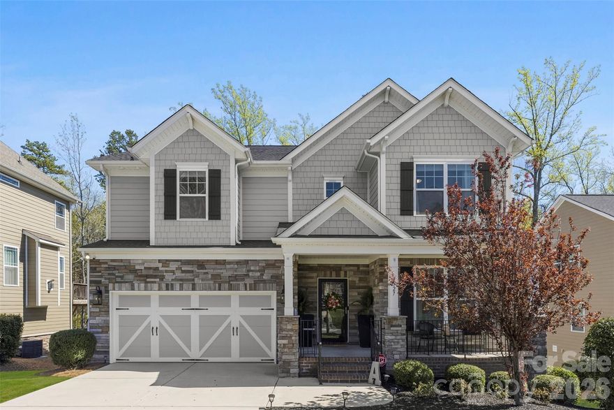 Stunning home located in the highly sought-after Whispering Pines section of the Palisades! This spacious 6-bedroom, 4-bath residence offers the perfect blend of luxury and comfort, featuring a gourmet kitchen designed for entertaining with granite countertops, a large island, gas cooktop and butlers pantry. The open floor plan offers multiple living spaces, with 4 bedrooms including the primary upstairs, a bedroom on the main level and a fully finished basement with a bedroom + full bath and bonus room; ideal for gatherings, recreation, or a home theater. Enjoy seamless indoor-outdoor living with a beautiful two-story deck overlooking the backyard — perfect for relaxing or hosting guests year-round. A rare opportunity to own an exceptional home in one of the area’s premier communities!  The Palisades offers resort style amenities: outdoor pool, clubhouse, fitness center, playground, pickleball & basketball courts and more.  Optional golf and tennis memberships are available at the Palisades Country Club.  *Lawn care is included with HOA dues making home care even easier!*. Don't miss the opportunity to live a short drive to Lake Wylie recreation and easy access to Charlotte and surrounding areas!