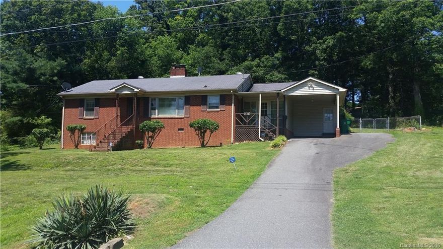 Back On Market! Brick home w/lots of Potential! Original hardwoods throughout. Eat-in Kitchen, Dining Rm/Sitting rm/Office off Kitchen. Features two Living areas or Den could easily be used as the 3rd BR. Home has 2 Fireplaces. Large front yard w/fenced in back. Nice covered Patio/Terrace. Seller will consider up to $1000 allowance toward paint, converting w/d hookup to main level or closing cost, buyer choice. Near Hwy 77 & 85. Home being Sold As Is. Inspection summary available upon request.