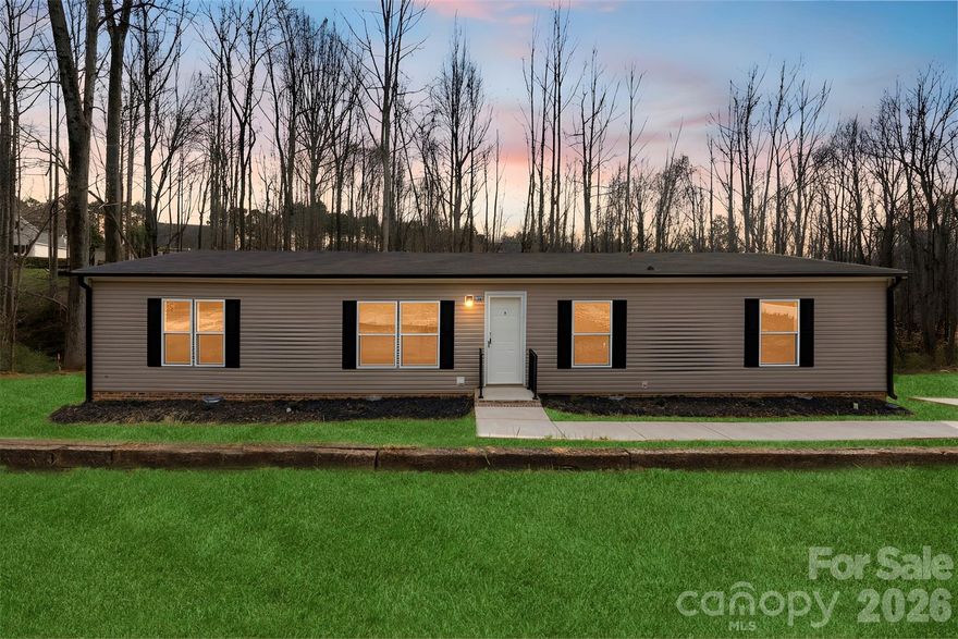 “Perfect Location Near Lake Norman! Situated on a spacious 0.95-acre lot, this beautiful property offers proximity to Lake Norman’s shopping, dining, and downtown Mooresville. The Phoenix model by Cavco features an open concept layout with 2 bedrooms, office and 2 baths across 1,680 sq ft of living space. The home boasts a large living room perfect for entertaining, a modern kitchen with LED lighting and appliances, and a utility room for added convenience. The primary suite includes an en-suite bathroom with a separate tub and shower. A new concrete driveway and a deck will be added, completing this move-in-ready gem!”  There are 5 units available in this neighborhood and they are selling fast!