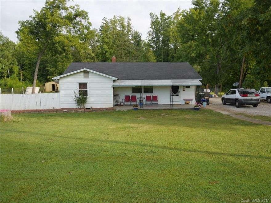 Located in Clover School Dist with 1.4 acres.Close to town but very private.All appliances except stove are less than 3 years old and refrig stays, new A/C unit & hot wtr heater in 2014.New windows,insulation, and insulated pipes last year.Bathroom updated with new tile, new floors, updated kitchen, large fenced lot with plenty of room for a garden.This property includes 2 parcels, 0100513032 which consists of Lots 257,259, & 260(City) and 363-00-00-021 (lot 258) which is in county.FHA approved