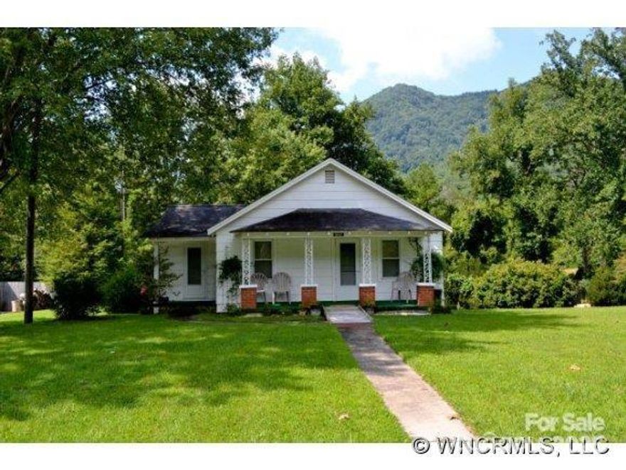 If you are looking for a cozy single family home with endless possibilities, this may be your property.  Whether you are looking for your family home or an investment property don't miss this 2 bedroom, 1 bath home, with an additional space for an office, nursery, etc. off the master bedroom.  There are hardwood floors under existing carpet, new metal roof, heat pump covered front porch overlooking a level large front yard, along with mountain views.  On the .67+/- acres with creek along the back, you have plenty of room for a garden, additions to the home, outside recreations area, whatever your heart desires.  The home needs some cosmetic upgrades.  You are convenient to all the recreational opportunities that the Western North Carolina mountains have to offer including the Blue Ridge Parkway & more.