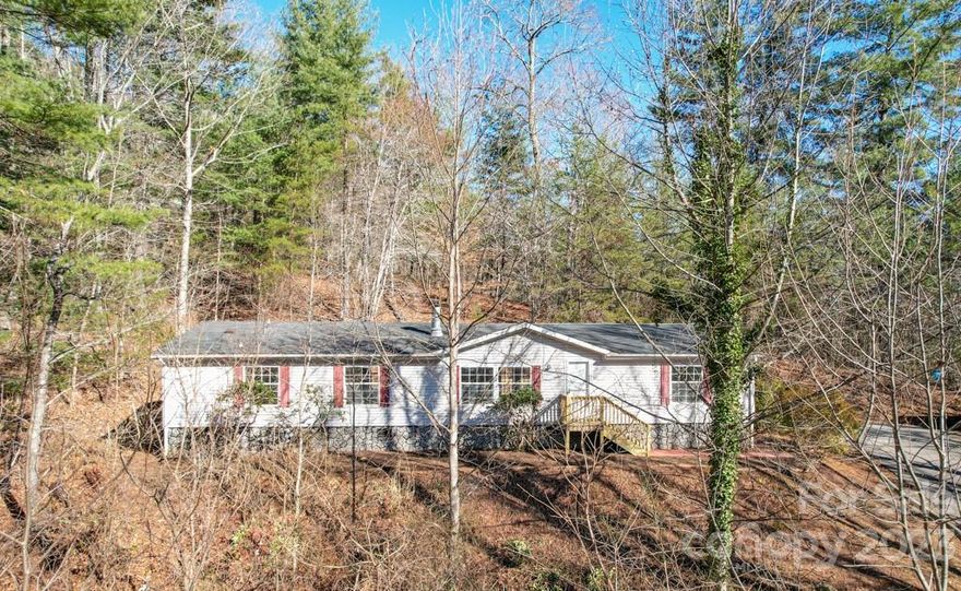 Accepting backup offers. If you are looking for a spacious 3 bedroom, 2 bath home in the country on 2+ acres - this is it! Kayce Acres is a small doublewide community with paved roads, and underground utilities. This home has been recently remodeled and is a must see with an open floorplan between the living room, dining room, and kitchen. The large windows fill the home with natural light and majestic views. Split bedroom floor plan with an ensuite bathroom off the primary. New stainless appliances in kitchen. The laundry is off the kitchen. There are nice mountain views in the winter. Possible year around views with tree trimming. A shed with electricity is beside the driveway.

Updates - fresh paint on walls, ceiling and cabinets. New stainless steel appliances, wood laminate flooring, toilets, light fixtures and ceiling fans, hot water heater and plumbing, new french door leading to the back deck. New front and side deck.