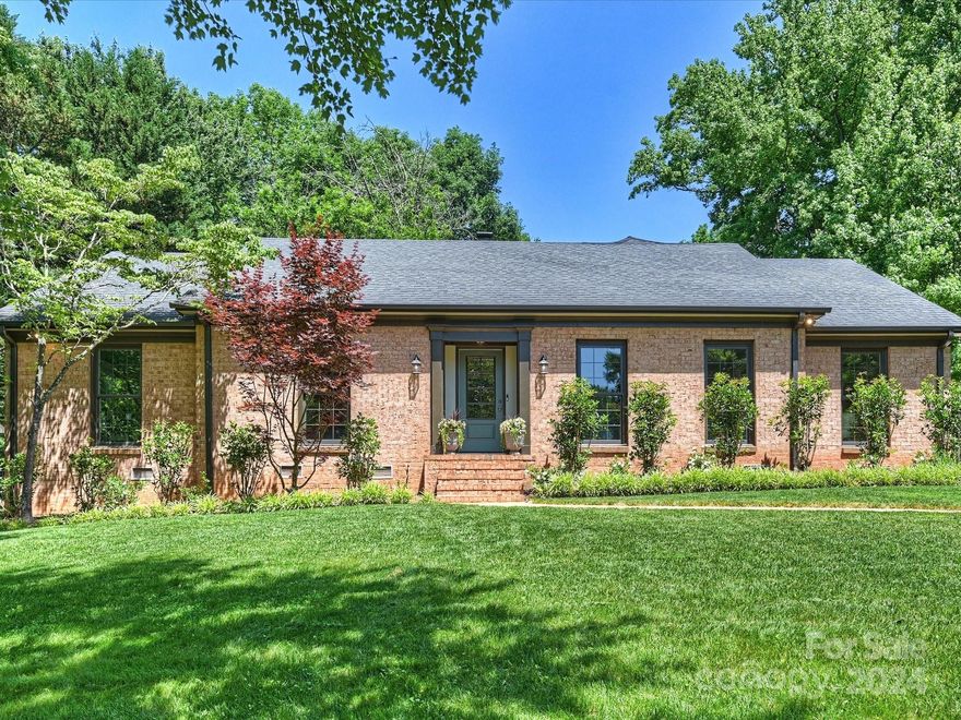 Talk about curb appeal! This well maintained 3 bedroom, 2.5 bath brick ranch is a show stopper. New Lincoln windows, new gutters, new exterior doors, hardwood floors, new interior trim work, and recessed lights. Enter right through the formal foyer to the large living room and spacious dining room. The bright white kitchen includes SS appliances, ample cabinet and countertop space, a built-in breakfast nook, and a dutch door into the den. The inviting den provides additional living space and includes a gas fireplace, recessed lights, built-in bookshelves. The spacious primary suite with two closets includes also includes a large primary bathroom with plenty of counter space, neutral tile, and a large shower. Outside, the screened-in porch is the perfect place to enjoy dinner alfresco. A stamped concrete patio leads to the large heated/cooled outbuilding - an amazing office, bonus room, gym, art studio - you name it! Additional shed allows for even more storage!