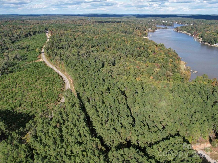 Explore this expansive 15+acre tract on the second row of Lake Wateree near Beaver Creek, with two properties being sold! Featuring over 3,000 feet of road frontage, this property offers ample space and accessibility. The parcel is also rich with mature timber, presenting potential for a harvest. Whether you’re looking to build your dream home or invest in land, this unique opportunity is not to be missed!