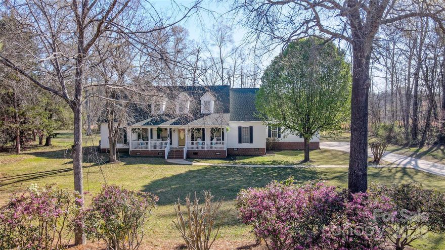 Welcome to serene, peaceful living on this one acre lot in York with NO HOA fee! Nestled on a beautiful, quiet street you'll find a picturesque cape cod style home with an inviting rocking chair front porch! 5 bedrooms, 3.5 baths, a 2 car garage, expansive back deck for entertaining, and a large bonus room upstairs! The primary bedroom is on the main level with tray ceilings, back porch access, a large walk in closet, and an en suite featuring a dual vanity, water closet, and separate soaking tub and shower! The kitchen has brand new countertops, brand new appliances- all included, plus the washer/dryer & extra freezer! The kitchen has a breakfast bar that will easily sit 4-5 bar stools plus an eat in kitchen area! There is also a formal dining room, gas log fireplace in the living room, as well as a large bonus room upstairs! The home has been meticulously maintained including a double water filtration system installed, gutter guards installed, new paint, & so much more!