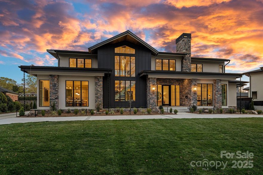 Mid-Century Modern estate in the heart of Southpark, designed by Brian Herman's, 2021 Axios Charlotte Home of the Year awardee, with interiors by Brooke Adler, IDS Designer of the Year 2024! A rare blend of sophistication, comfort, and luxury; both inside and out! The main level includes a private owner's suite, leading to the outdoor oasis with a spa-inspired bath featuring gorgeous modern tiling, a sleek frameless walk-in shower, & ceramic basin tub, while the gourmet kitchen features professional-grade monogram appliances, quartz counters, custom cabinetry encompassing the commercial grade built-in refrigerator/freezer, leading to the scullery. An abundance of natural light, gas fireplaces, and brilliant architectural touches adorn the living spaces! Additional en-suite beds, loft, office space, and a 2nd laundry room all up. Panoramic sliding doors open to your private backyard; with a pool and spa that are accompanied by outdoor living spaces for all seasons-NEW mature landscape!