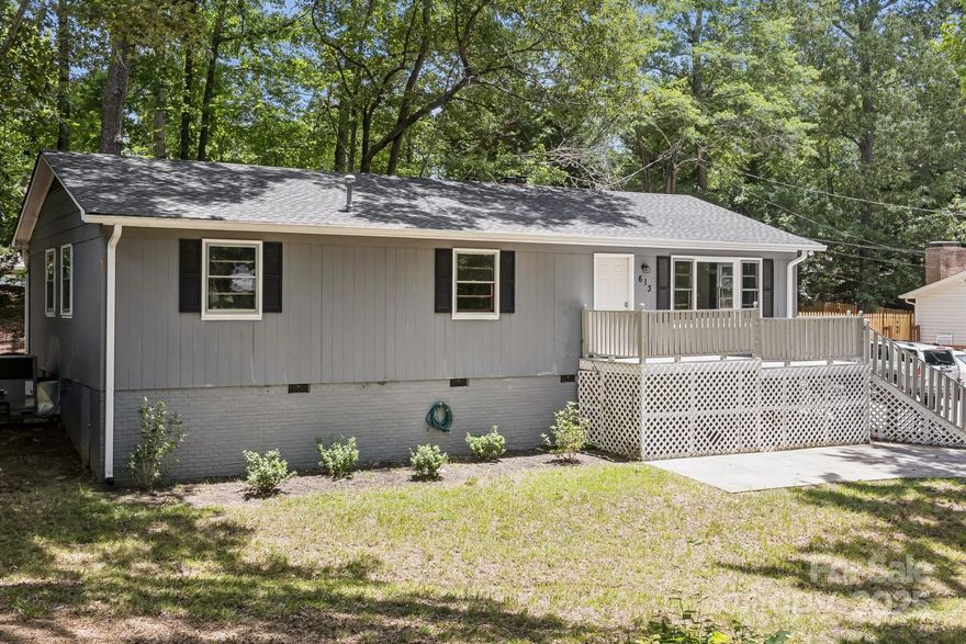 This fantastic 3 bed, 1.5 bath home is just what you've been waiting for. The house sits on a huge shaded lot but still has much desired natural light inside the home. The half-wrap around deck is perfect for entertaining, porch sitting, or just simply hanging out outside! The inside has undergone extensive upgrades! The flooring has been replaced from the floor joist up in the bathrooms, kitchen, and living room. Crown molding has been installed, new wooden attic stairs, some of the wood paneling was replaced in the living room new dryer duct piping,  a plumbing access box was added in the laundry room closet, a water shut off valve was added in the crawl space for the water line that comes in from the street, a new vapor barrier was added, new refrigerator and microwave were added and will remain, sheetrock repairs were made in various areas to make cosmetic repairs, and there is new fresh paint throughout. You don't want to miss this opportunity! This home is truly move in ready!!!