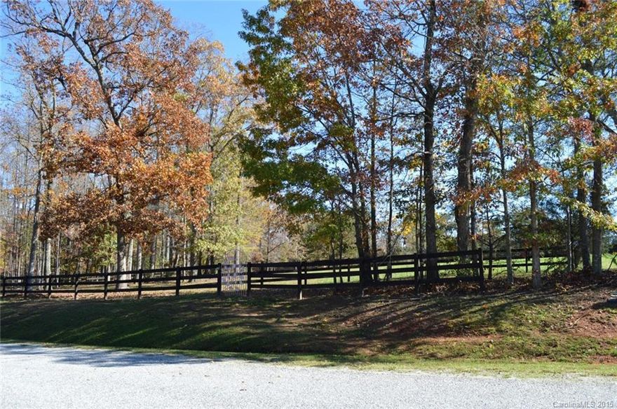 6.04 acres with a mix of woods and established fenced pasture. Two separate pastures with three board fencing and a two stall Morton run-in shed. Water already available. Direct trail access and use of two riding rings is a short hack away.Would make a wonderful small horse farm or very suitable for a single family residence. 
(septic system required but not in place)
